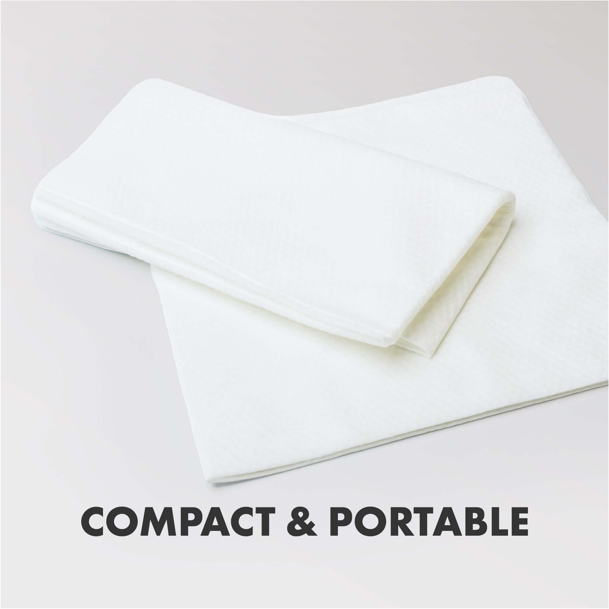 Image of the actual Eco Dog Towels saying compact and portable